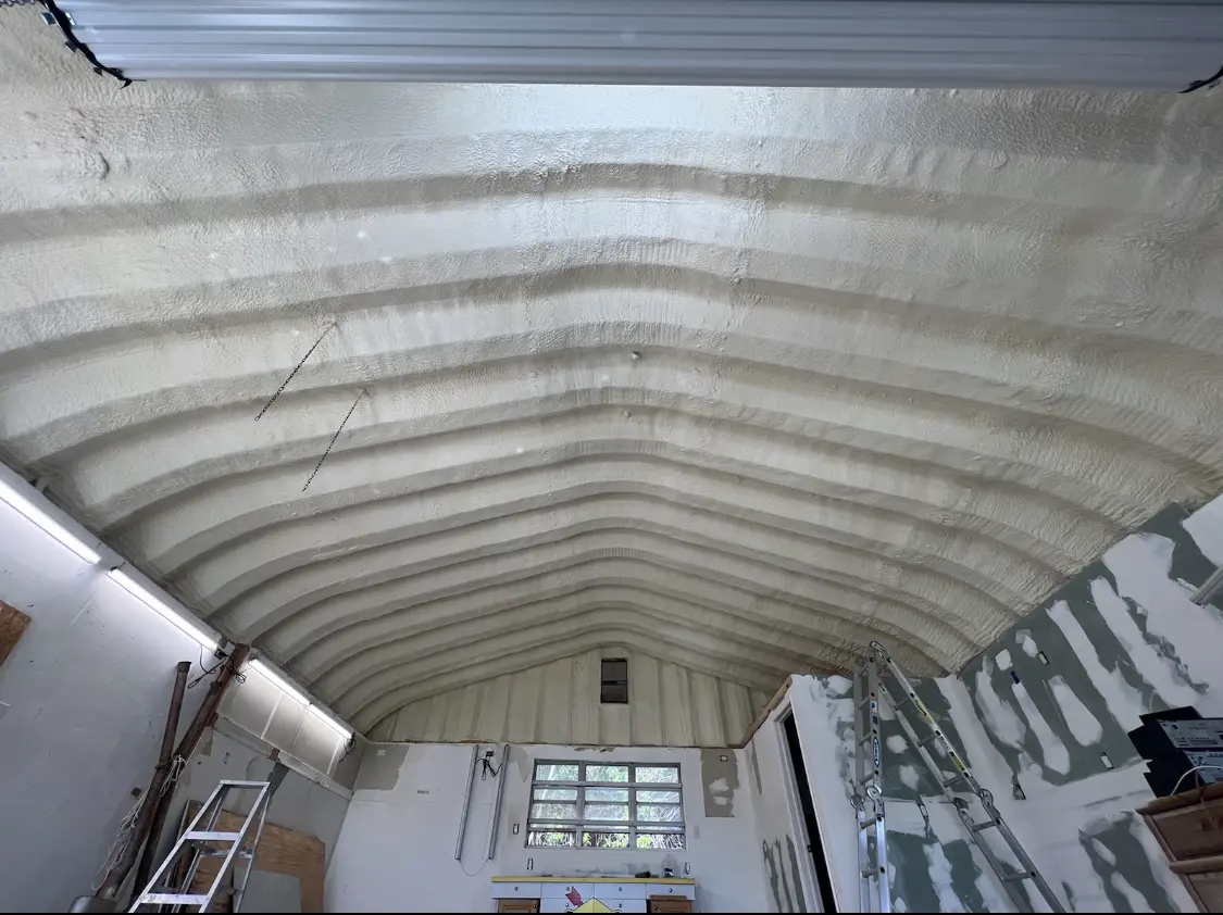 Spray polyurethane foam applied to the underside of a metal roof deck in Oakwood